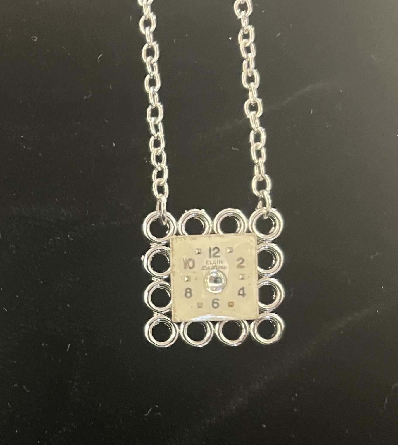 Necklace, Square silver pendant made of circles with Square Elgin Watch Face